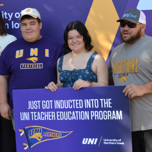 Student with family at convocation 